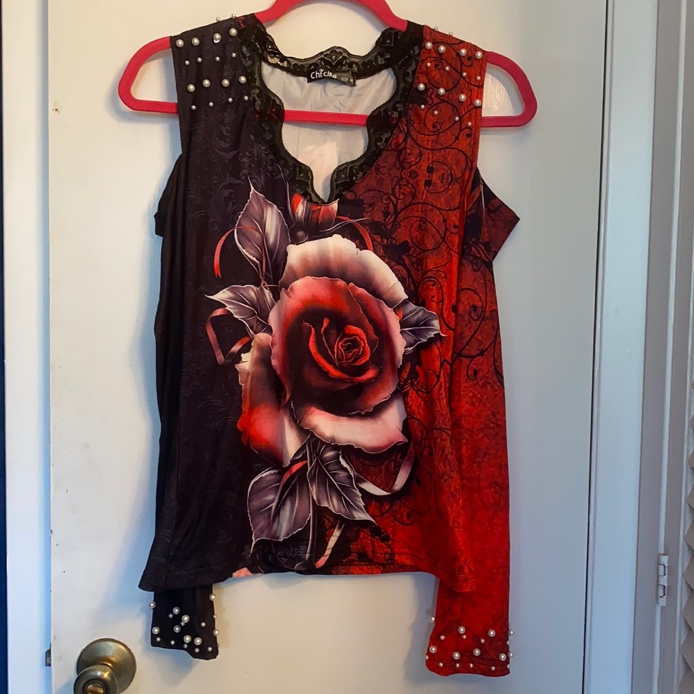A beautiful open shoulder blouse with pearls
